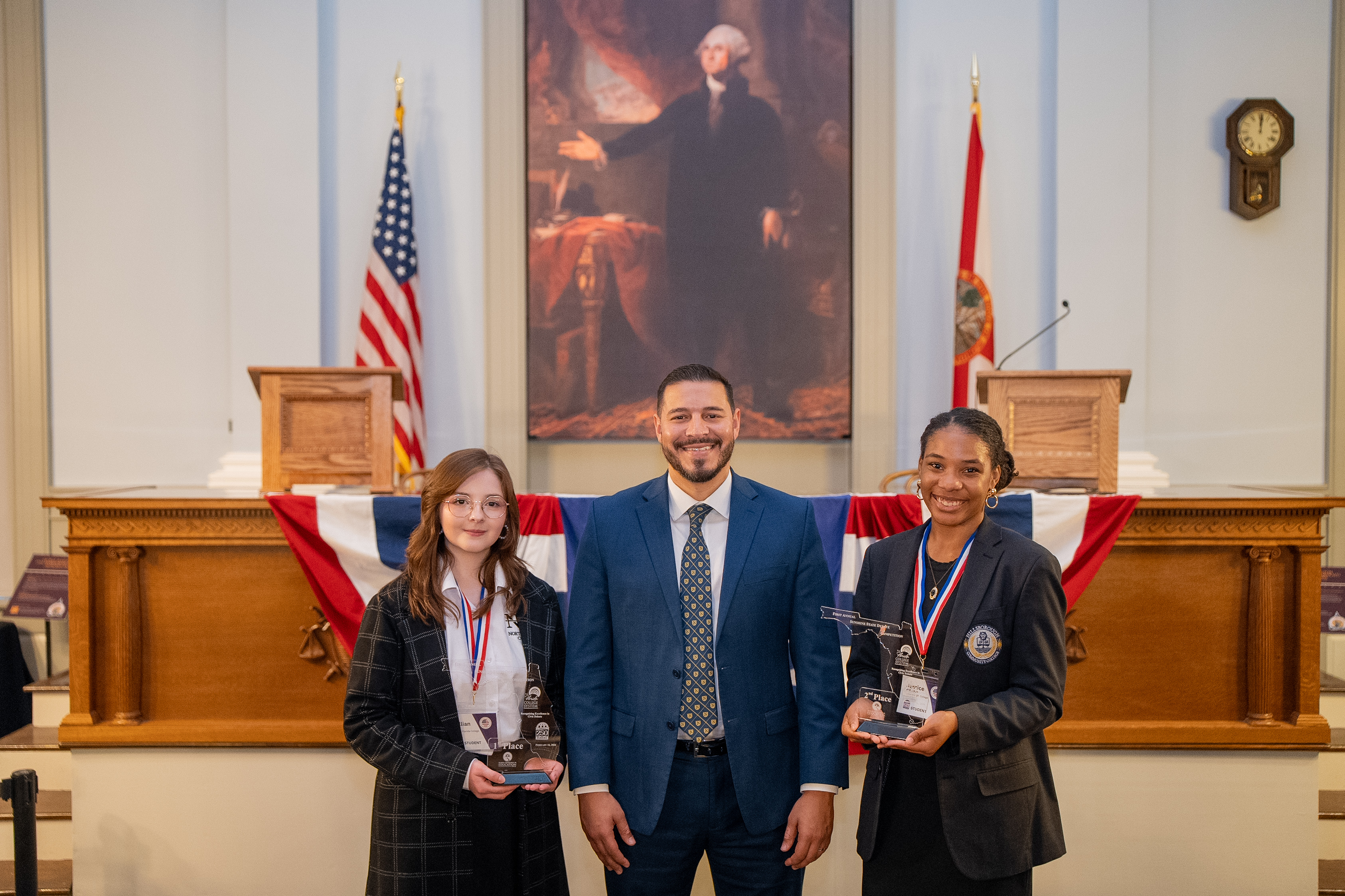 Commissioner of Education Anastasios Kamoutsas with first place winner Lillian Clay of North Florida College and second place winner Justice Robinson of Hillsborough College at the Sunshine State Debate Finals
